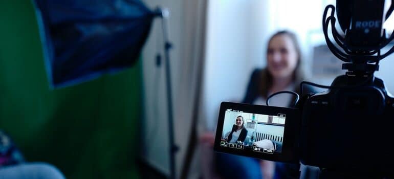 Two people recording one of the most engaging types of content - videos.