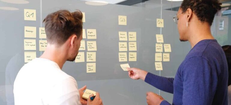 Two people are brainstorming ideas for social media post that work.