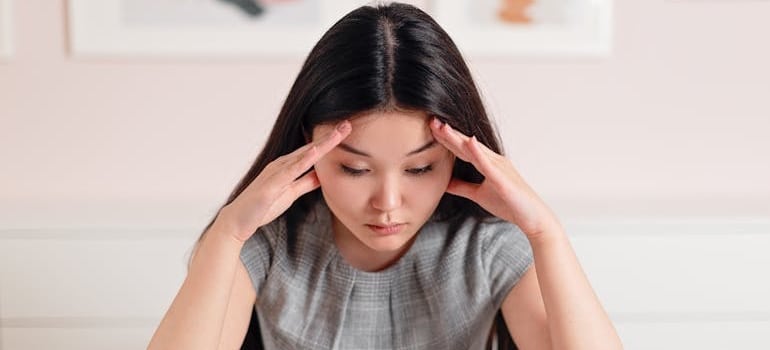 A person struggling with challenges of business operations